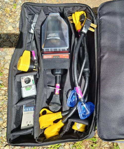 Lower portion of the Power Grip Electrical Accessory Bag, unzipped to show contents.